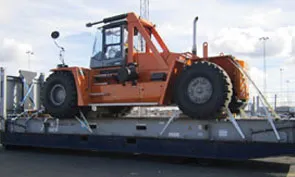 tractor-secured-to-a-flat-rack-with-cordstrap-lashing