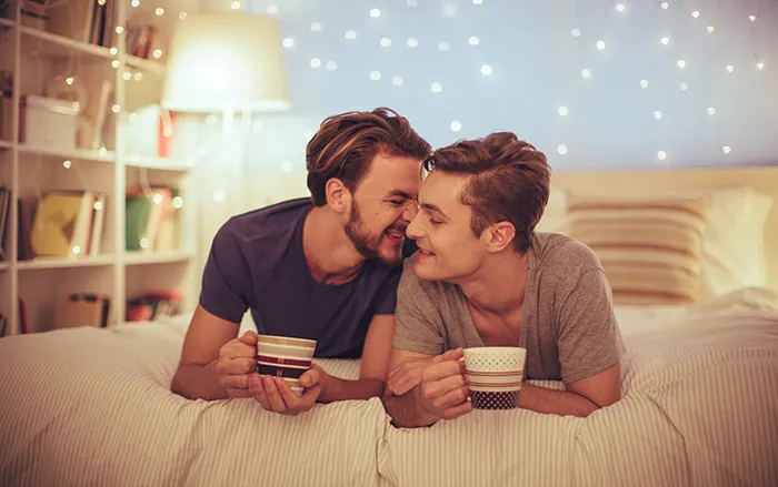 Young-gay-couple-in-bedroom