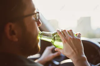 pngtree-woman-drinking-beer-while-driving-a-car-photo-image3095575