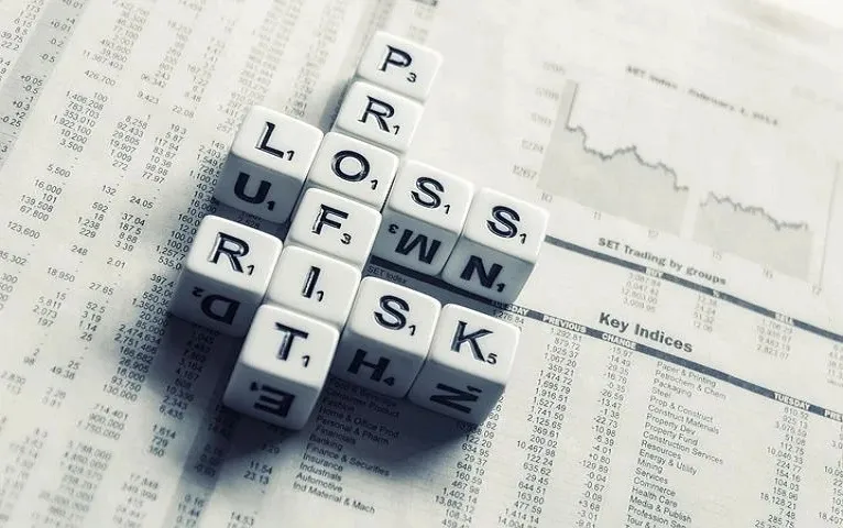 dices-over-newspaper-2656028480