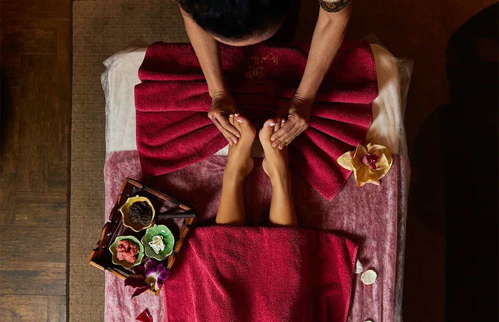 beautician-does-feet-massage-woman-visitor-resort