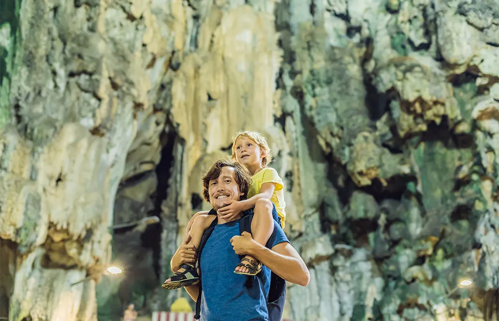 father-son-background-batu-caves-near-kuala-lumpur-malaysia-traveling-with-children-concept