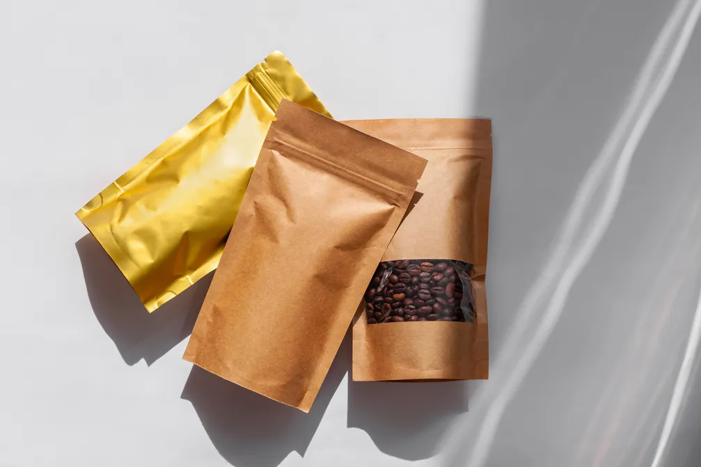 brown-kraft-paper-pouch-bags-with-coffee-beans-top-2023-11-27-05-02-57-utc