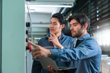 male-asian-caucasian-engineer-professional-having-discussion-standing-consult-machine-factory-two-expert-coworker-brainstorm-explaining-solves-process-cnc-operate-machine4760903