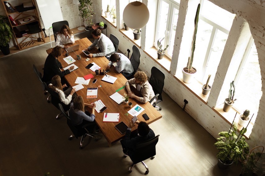 top-view-image-motivated-employees-working-together-office-official-meeting-concept-business