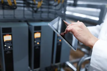 technologist-with-grey-tablet-his-hands-make-set-up-production-line-while-standing-department-dairy--(1)