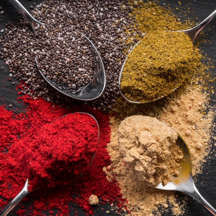 flat-lay-colorful-spices-black-background