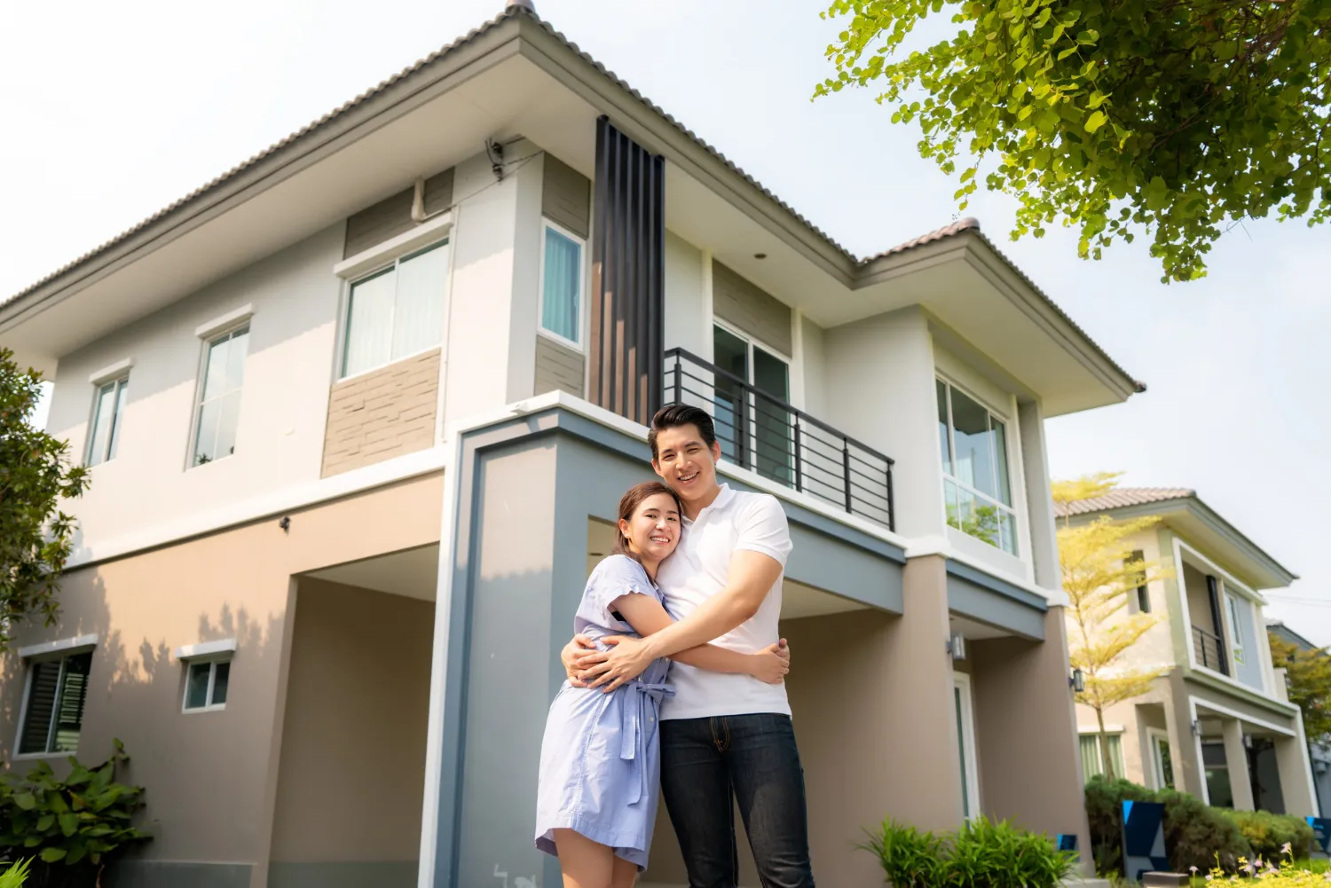 happy-in-front-of-new-house