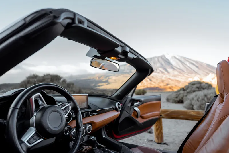 convertiblle-sports-car-on-the-mountain-roadside-2026-03-25-02-58-18-utc