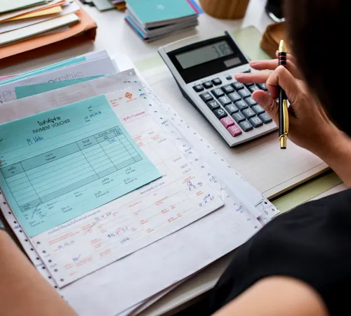 asian-woman-working-through-paperwork