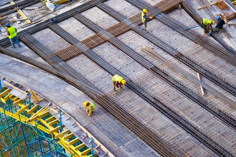 workers-putting-metal-structure-construction
