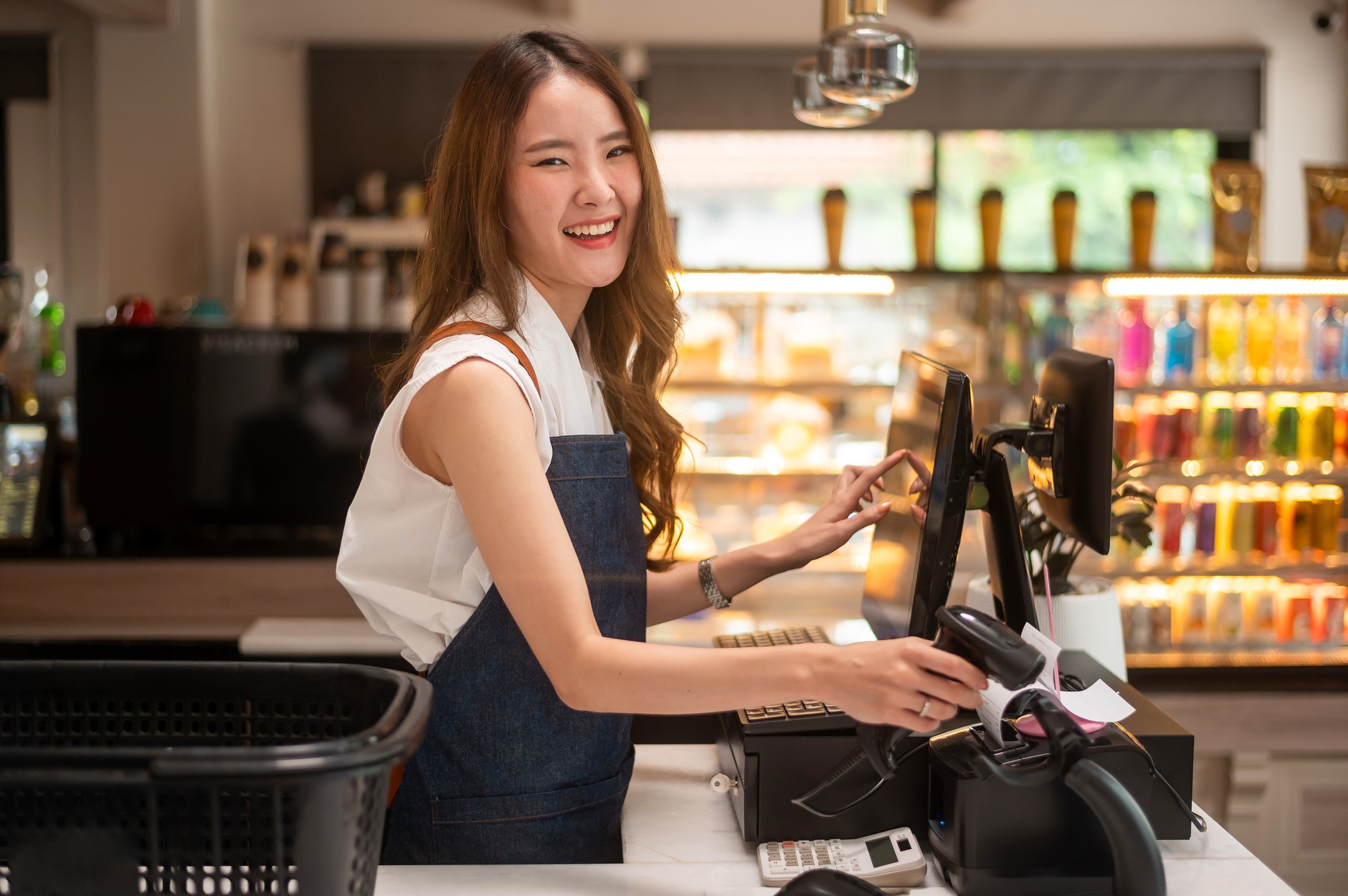 an-asian-young-cashier-woman-working-in-supermarke-2024-12-22-23-18-15-utc