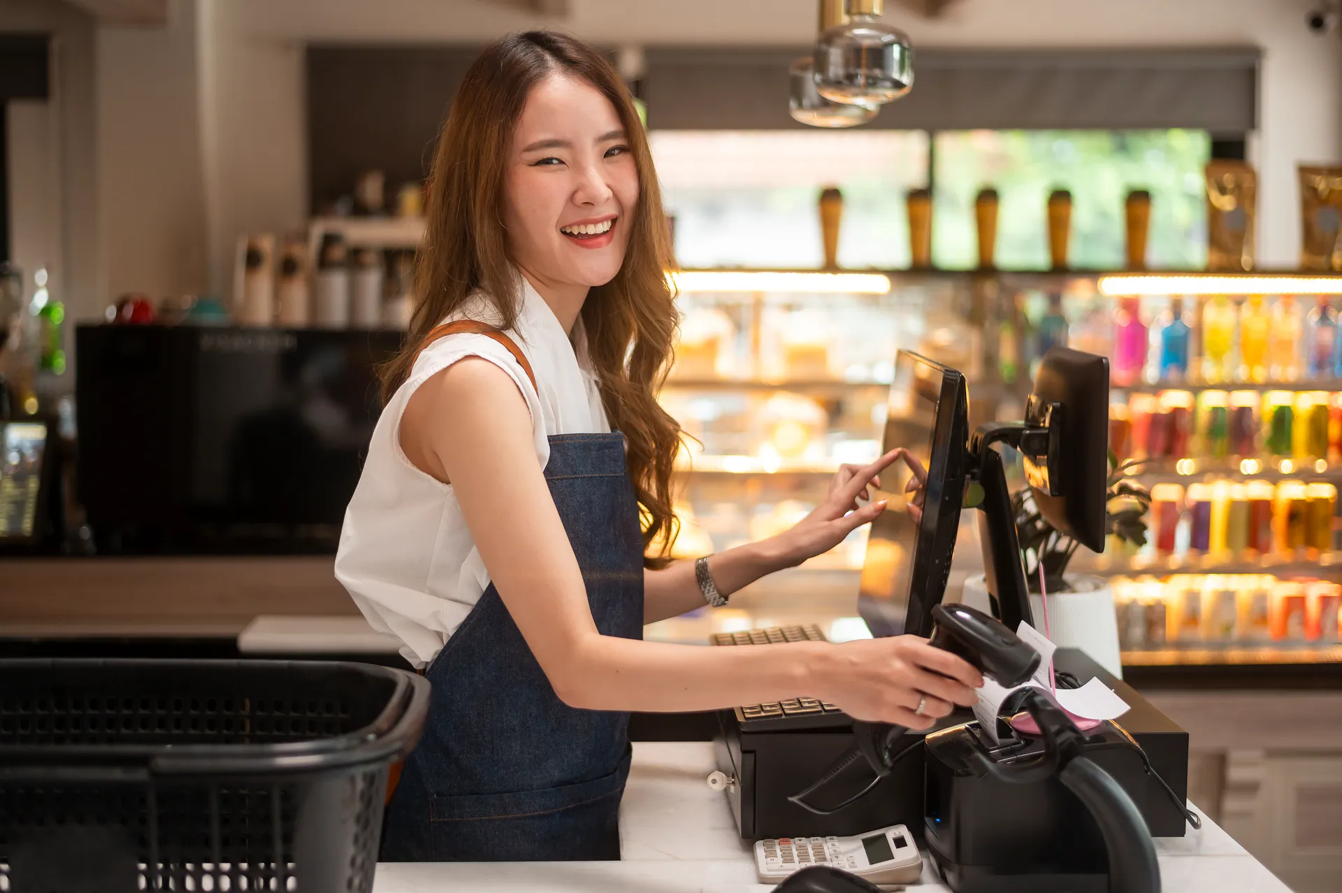 an-asian-young-cashier-woman-working-in-supermarke-2024-12-22-23-18-15-utc