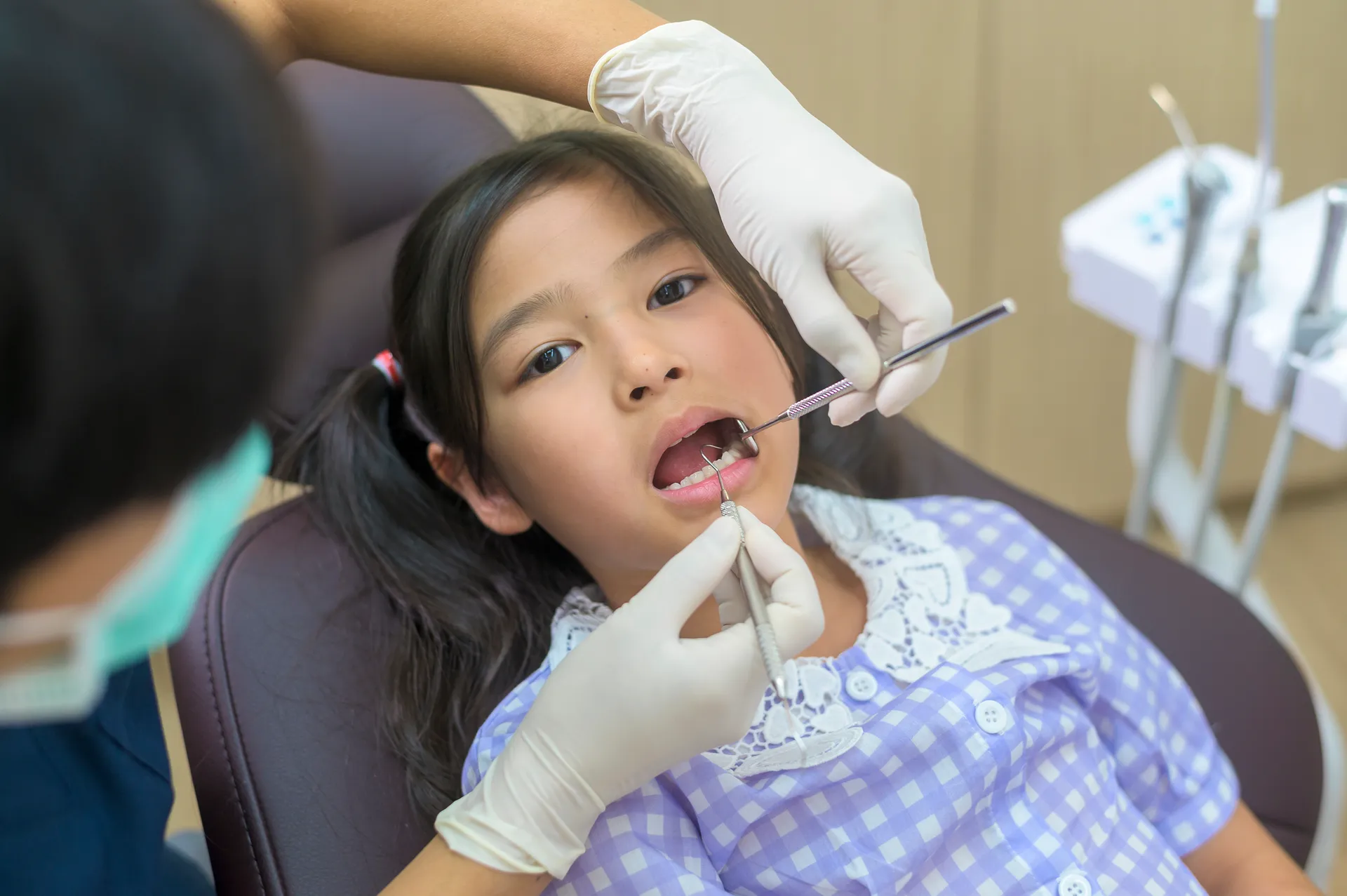 little-cute-girl-having-teeth-examined-by-dentist-dental-clinic-teeth-checkup