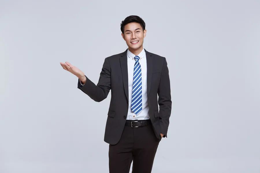 handsome-friendly-face-asian-businessman-smile-formal-suit-white-background-studio-shot