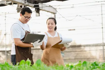 portrait-asian-farmer-man-woman-working-with-laptop