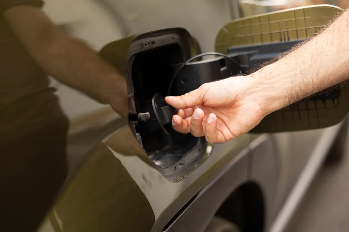 closeup-man-opening-ev-vehicle-inlet-port-attach-electric-cable