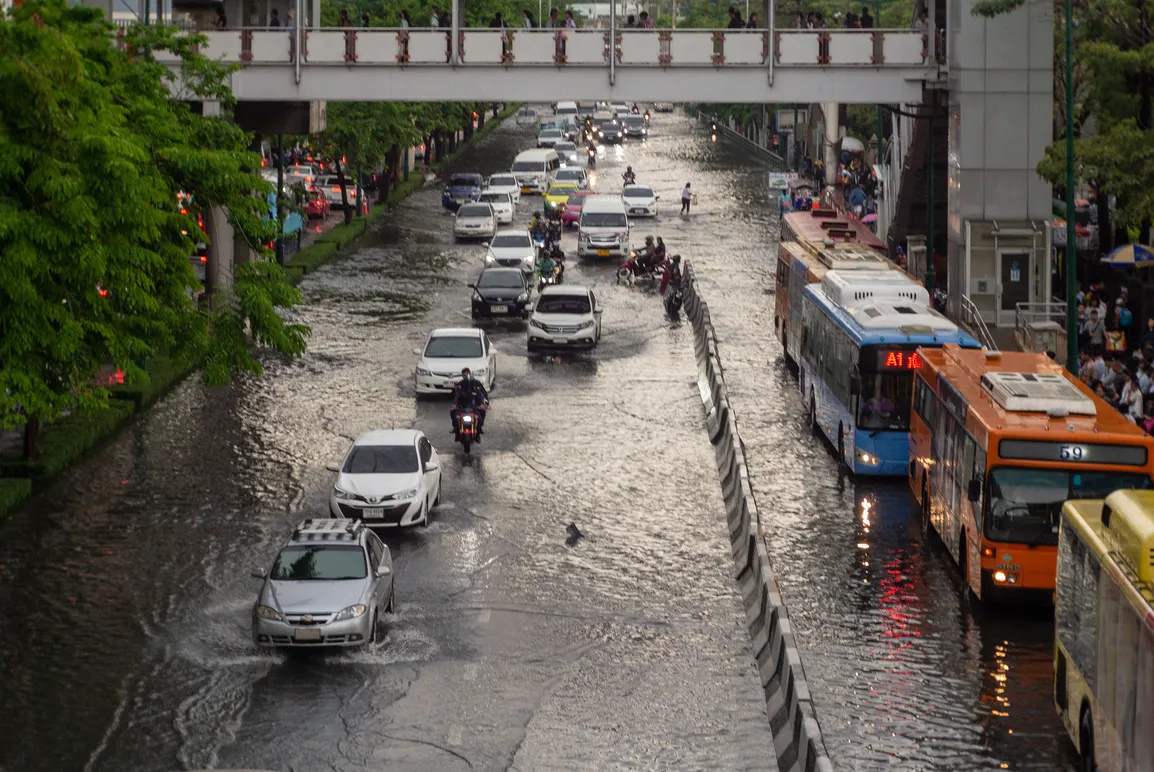 high-angle-view-vehicles-road-along-canal