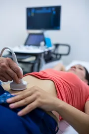 woman-getting-ultrasound-abdomen-from-doctor