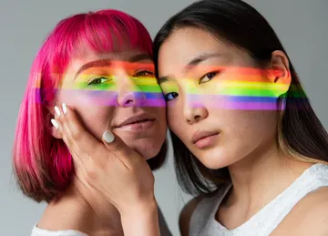 female-couple-with-rainbow-symbol