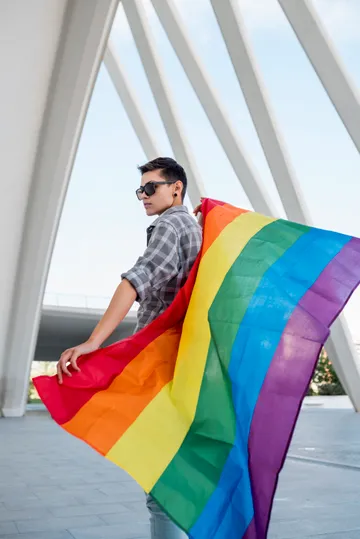 homosexual-holding-rainbow-flag(1)