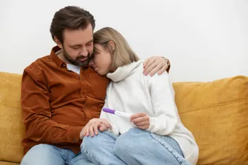 medium-shot-sad-couple-couch