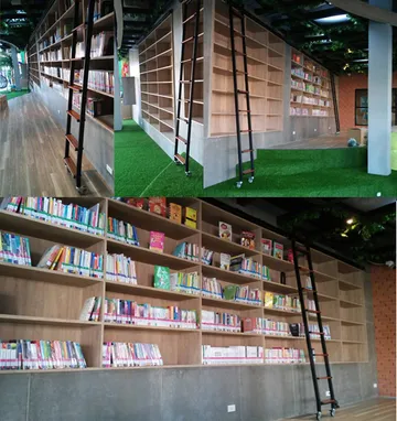 บันไดรางเลื่อนใช้หยิบหนังสือในห้องสมุดอุทยานแห่งการเรียนรู้โกลเด้นวิคตอเรียซอยสวนผัก